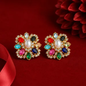 Queenora multicolour floral stud earrings with pearl centre and sparkling crystal detailing on red velvet